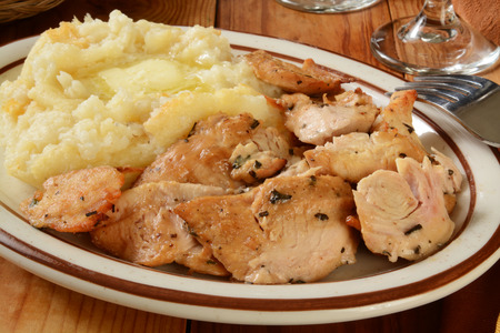 Succulent turkey morsels with mashed potatoes and butterの写真素材