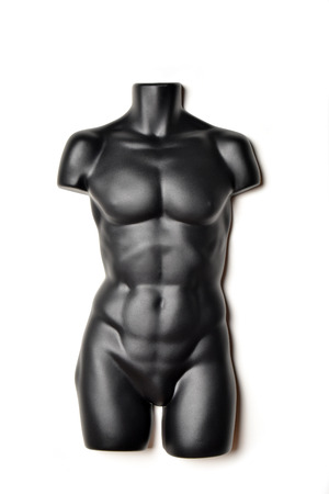 A black, male mannequin torso on a white backgroundの写真素材