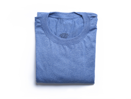 A folded blue t-shirt from a high angle viewの写真素材