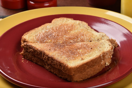 Hot buttered whole grain toast on a plate