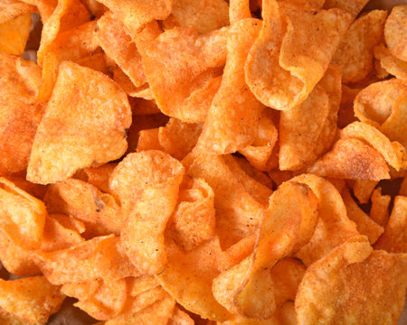 Overhead view of a mound of barbecue potato chips