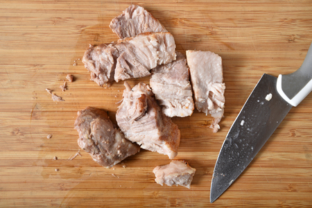 Overhead view of sliced pork belly on a cutting boardの写真素材