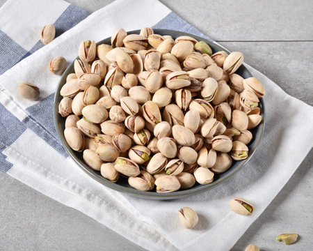 High angle view of a bowl of fresh organic pistachios