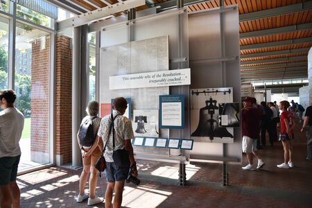 PHILADELPHIA, PENNSYLVANIA, USA - JUNE 26, 2019: Tourists viewing historic information displays at the Liberty Bell Center in Philadelphiaのeditorial素材