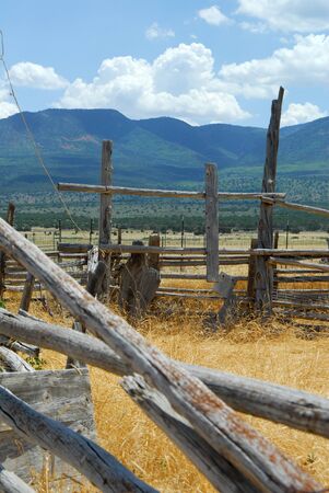 Remains of an old abandoned ranch corral in a southwestern valleyの写真素材