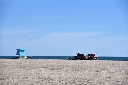 HUNTINGTON BEACH, CA/USA - Lifeguard hut and vehicles on the beachのeditorial素材