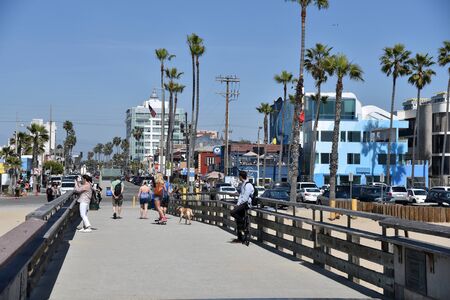 LOS ANGELES, CA/USA - April 6 2017: Tourists enjoying the Venic Beach Fishing Pier on a beautiful summer dayのeditorial素材