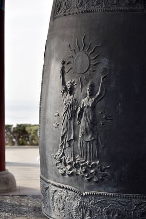San Pedro California, December 25, 2017: Intricate art detail on the Korean Bell of Friendship.  This massive and intricately-decorated bell and pavilion was donated in 1976 to the people of Los Angeles by the people of the Republic of Korea to celebrate のeditorial素材