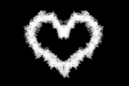 White smoke in the shape of a heart on a black background.の写真素材