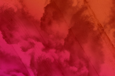 Abstract background with clouds and sky in pink tones. Toned.