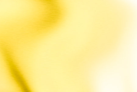 Gold metal background or texture of brushed steel plate with reflections. Iron plate and shinyの写真素材