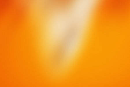 Abstract blurred orange background. Colorful background with bokeh defocused lightsの写真素材