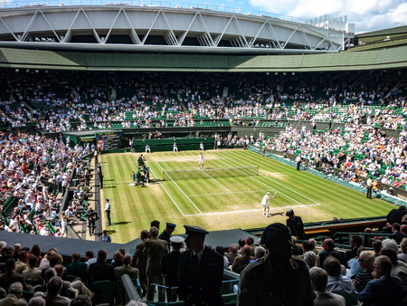 London, UK - July, 2014: A tennis match on Centre Court during the Wimbledon championshipsのeditorial素材