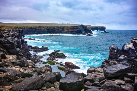 Volcanic rock along the coastline of Suarez Point, Espanola, in the Galapagos Islandsの写真素材