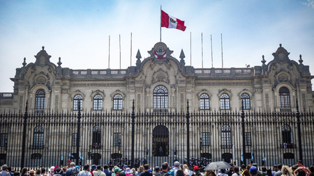 Lima, Peru - April 7, 2018: Tourists watch the Changing of the guards ceremony outside the Peruvian Government Palaceのeditorial素材