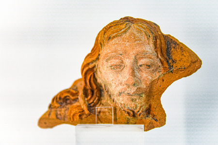 Lisbon, Portugal - July 26, 2019: A segment of a ceramic pot depicting Jesus Christ, on display at the Sao Jorge Castle Museumのeditorial素材