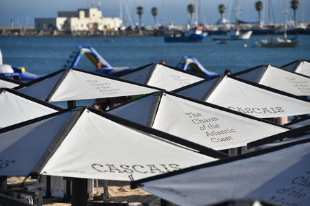 Cascais, Portugal - July 24, 2019: Parasols and sun loungers on the beach in the resort town of Cascais, Portugalのeditorial素材