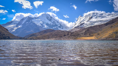 The turqoise waters of Lago Cochajasa at the foot of Mt Ausangate. Cusco, Peruの写真素材
