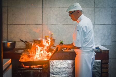 Lima, Peru - Nov 14, 2019: Peruvian Chef Javier Wong, prepares fresh ceviche and seafood dishes at his restaurant 'Chez Wong'のeditorial素材