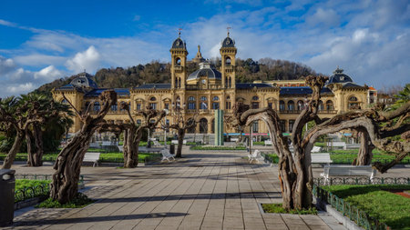 San Sebastian, Spain - April 2, 2021: Tamarind trees in front of city hall in Alderdi Eder Parkのeditorial素材