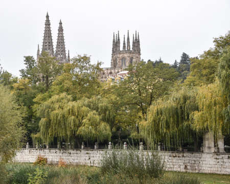 Burgos, Spain - 16 Oct 2021: Views of the Santa Maria Cathedral from the Arlanzon riverのeditorial素材