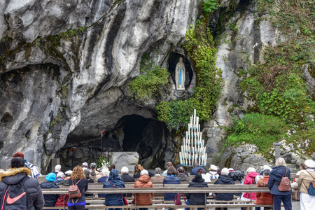 Lourdes, France - 9 Oct 2021: Catholic Pilgirms attend a mass services at the Massabielle Grotto at the Rosary Basilica of Lourdesのeditorial素材