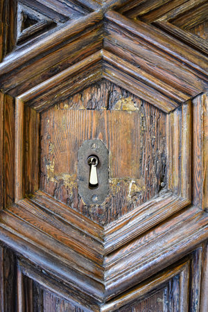 Barcelona, Spain - 23 Nov, 2021: Wooden door keyhole at the Archive of the Crown of Aragon in Barcelona, Catalonia, Spainのeditorial素材