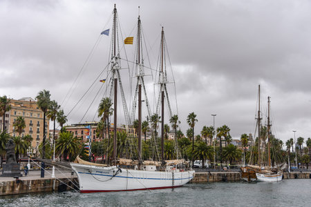 Barcelona, Spain - 24 Nov, 2021: Vintage sailing boat moored in the marina at Port Vell in...