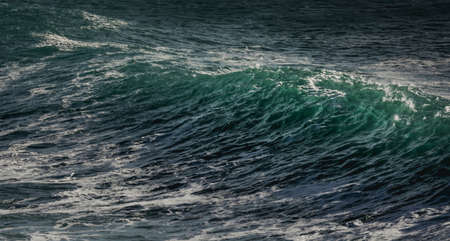 A glassy wave about to crashの写真素材