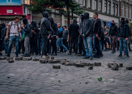 Sternschanze Hamburg, Germany - July 7, 2017: Protesters loosen stones to throw on police forces...