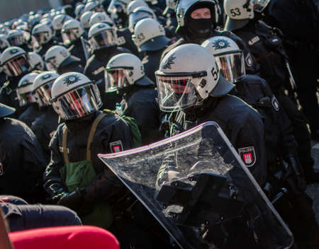Fishmarket Hamburg, Germany - July 6, 2017: Policemen in full gear at the demonstration.のeditorial素材
