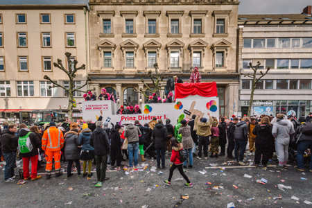 Aachen, Germany - February 12, 2018: The Aachen Rose Monday procession in the carnival. People in traditional costume throwing candyのeditorial素材