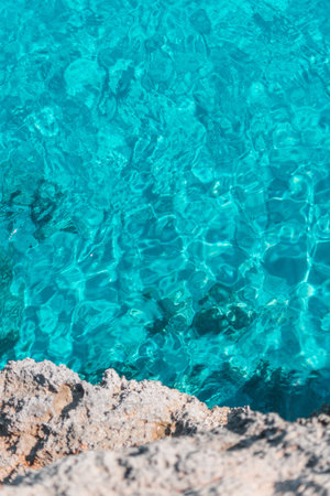clear turquoise ocean water, tropical vibe, Mediterranean Sea, Mallorca, Spain. White cliff stone