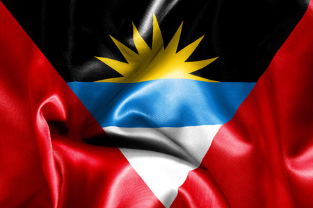 Antigua and Barbuda flag texture creased and crumpled up with light and shadowsの写真素材