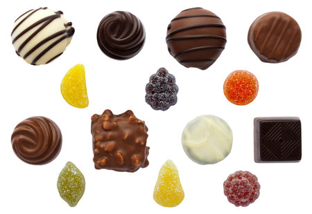 Mixed sweets with chocolates and fruit pastilles on an isolated white background with a clipping...