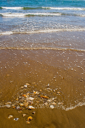 Waves Breaking on a Sandy Beachの写真素材
