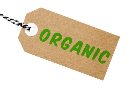 Organic label made from cardboard with string on an isolated white background with a clipping pathの写真素材