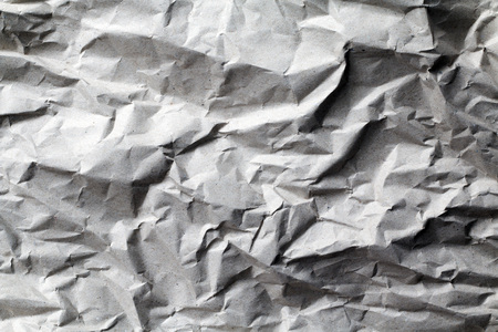 Crumpled up recycled paper texture backgroundの写真素材