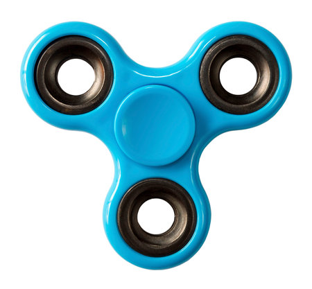 Finger spinner made of blue plastic on an isolated white backgroundの写真素材