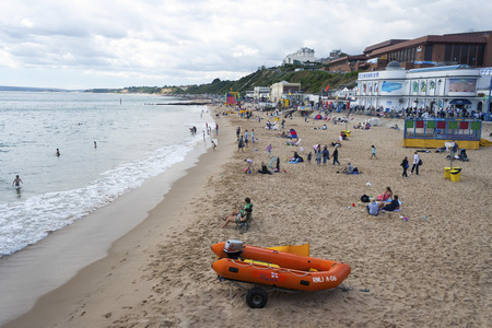 Bournemouth, Dorset, UK - August 29, 2006: People relaxing on a sandy beach on a summer day in Bournemouthのeditorial素材