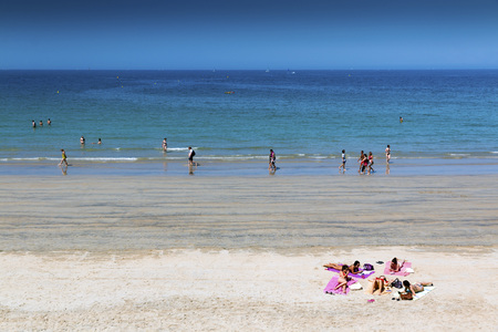 Saint Malo, Brittany, France - July 7, 2018: Saint Malo sandy beach with people relaxing and sunbathing on a hot summer day with a clear blue skyのeditorial素材