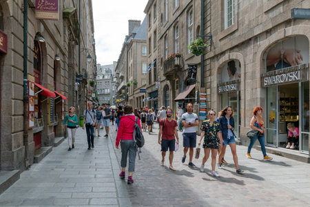 Saint Malo, Brittany, France - June 23, 2019: Looking along busy shopping street Rue Saint-Vincent on a hot summer dayのeditorial素材