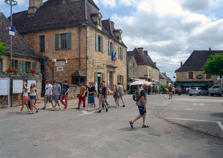 Domme, Dordogne, France - July 9, 2012: Domme historic town centre with tourists on a hot summer dayのeditorial素材