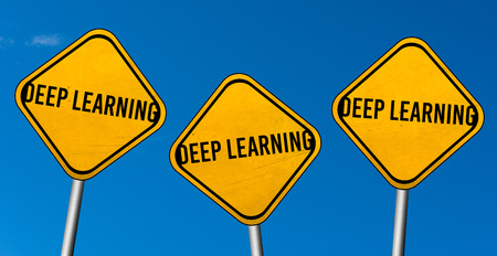 Deep learning - yellow signs with blue skyの写真素材