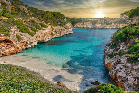 Paradise Calo des Moro Beach in Majorca Mallorca, Spain during sunsetの写真素材