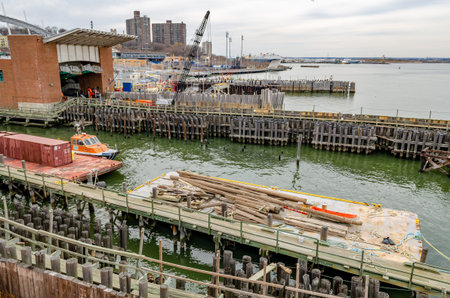 Ferry Terminal to Manhattan at Staten Island with wood jetty, New York City, during winter day with...