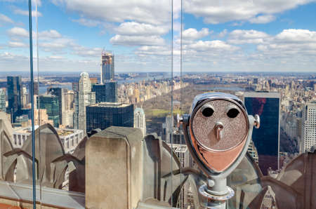 Central Park New York City with binoculars and glass fence in the front, aerial view from Rockefeller Center during winter, horizontalのeditorial素材