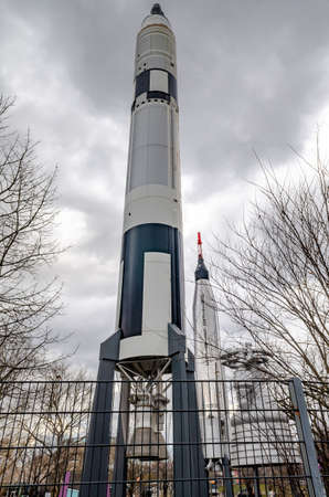 Two Rockets at New York Hall Of Science, low angle view, fence in front, Queens, New York City during overcast winter day, verticalのeditorial素材