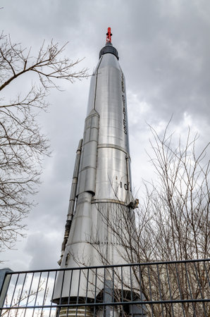 Silver United States Rocket at New York Hall Of Science, low angle view, fence in front, Queens, New York City during overcast winter day, verticalのeditorial素材