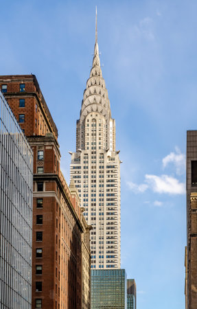 Chrysler Building, New York City with clear sky, view from the distance with other office building...
